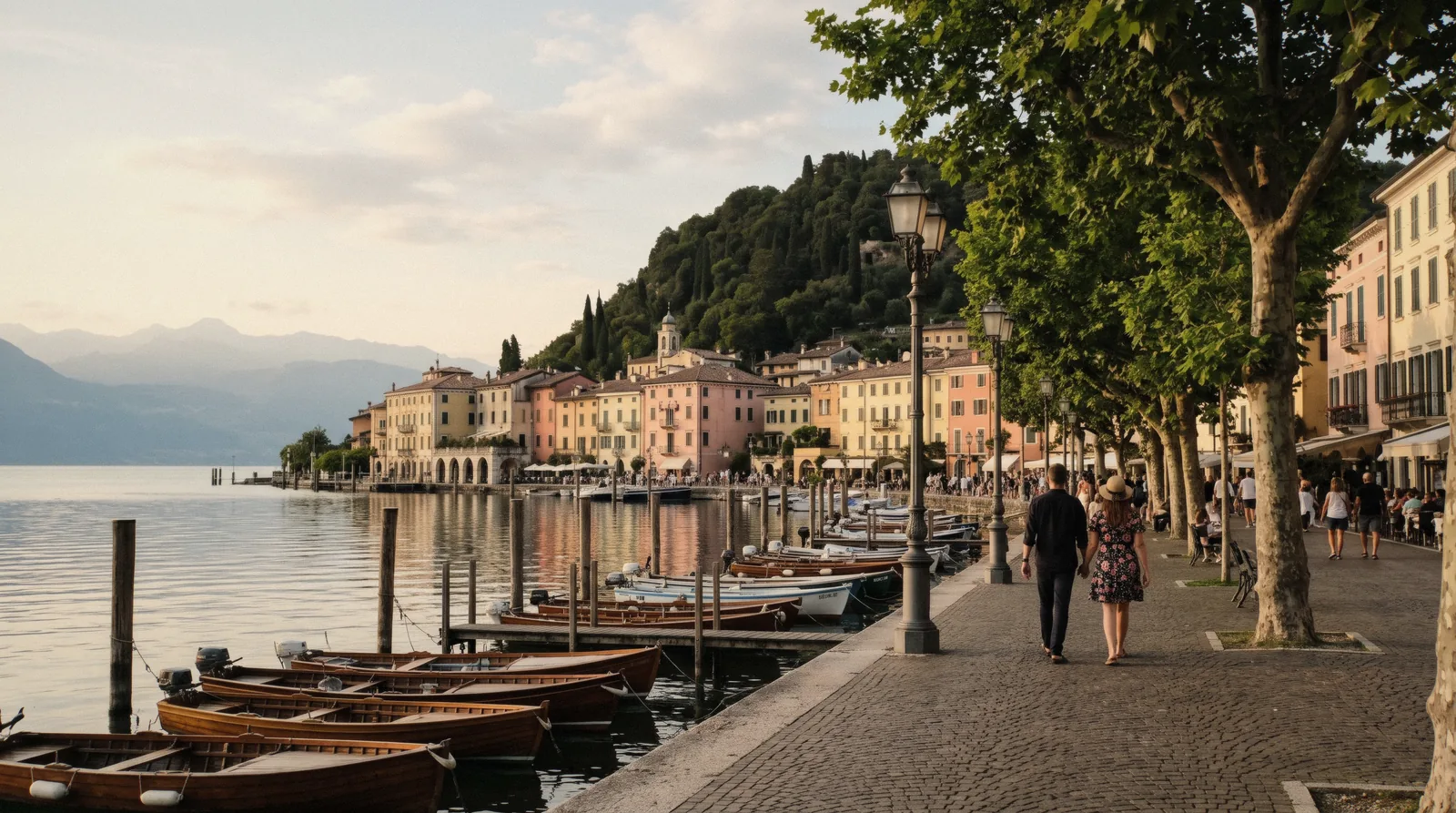 The lakefront promenade of Garda town on the east shore of Lake Garda, Italy, with the Rocca hill behind