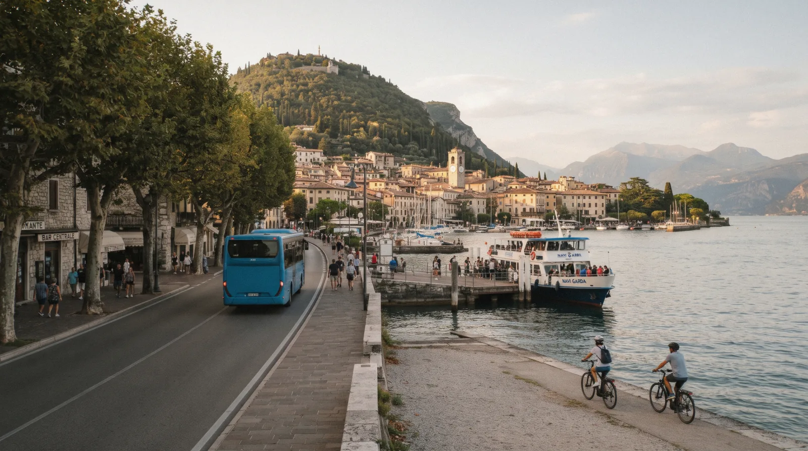 A bus and a passenger boat on the lakefront at Garda town on the east shore of Lake Garda, Italy