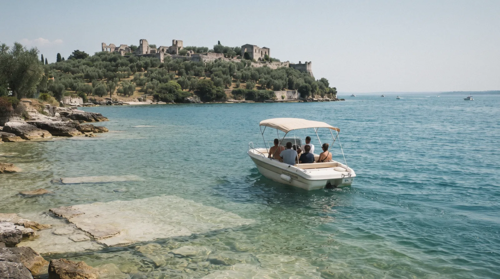 A small motorboat off the Sirmione peninsula below the Grottoes of Catullus on Lake Garda, Italy