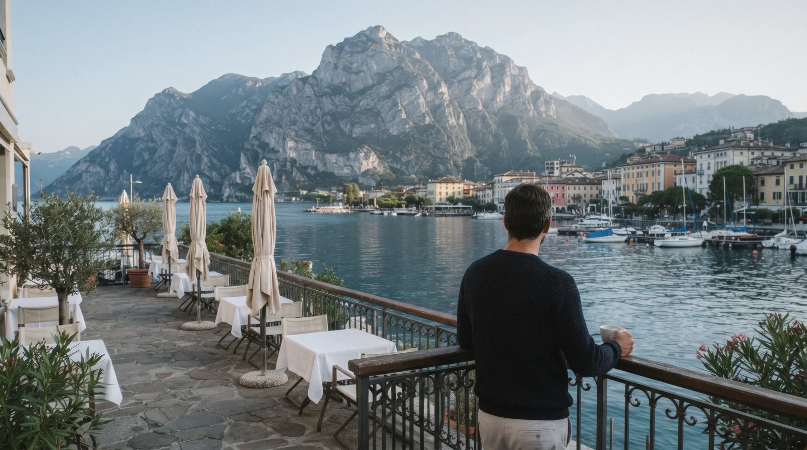 A hotel breakfast terrace above the water in Riva del Garda, Lake Garda hotels, Italy