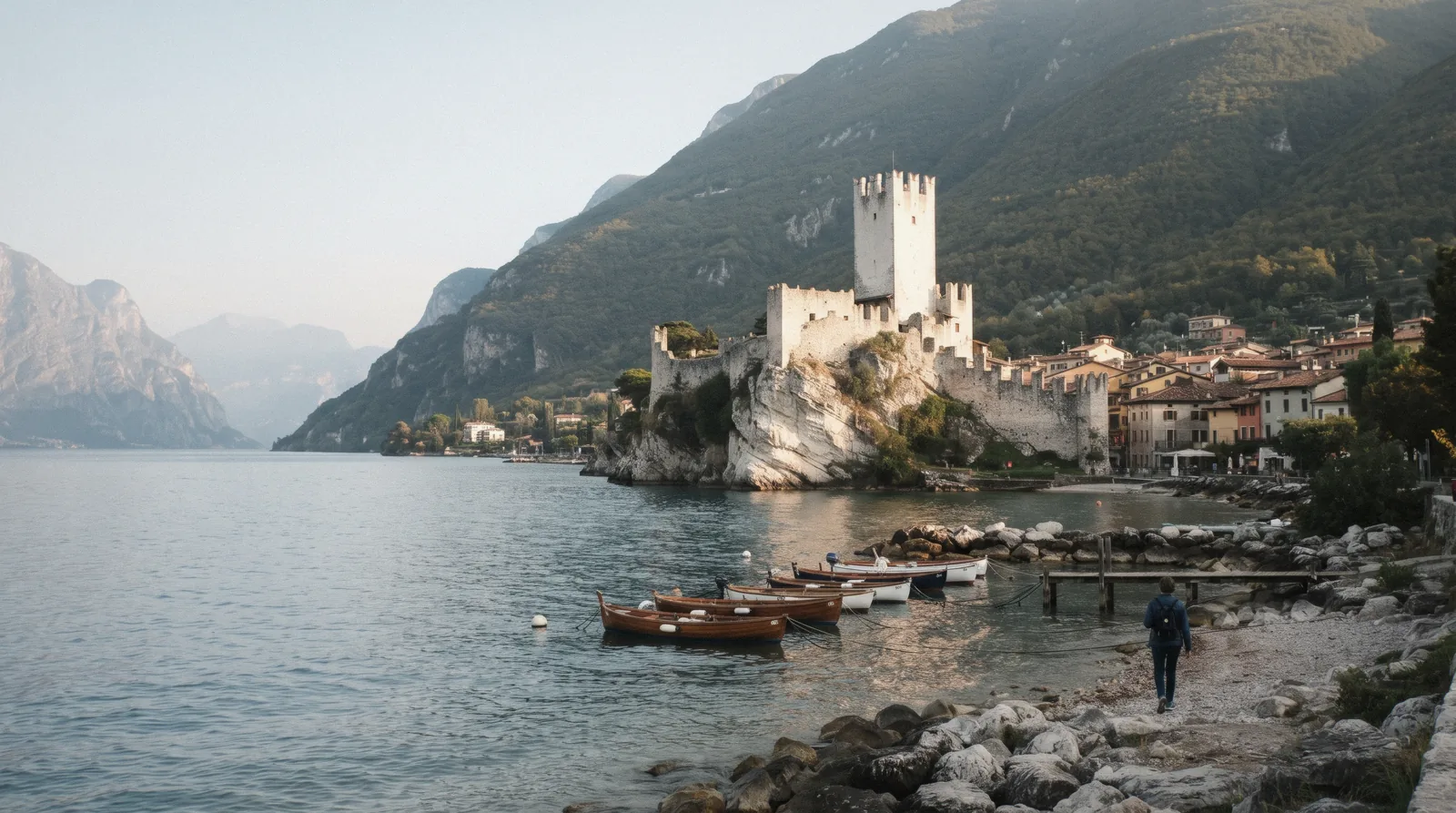 The Castello Scaligero di Malcesine on its rock above the water at first light, Lake Garda, Italy
