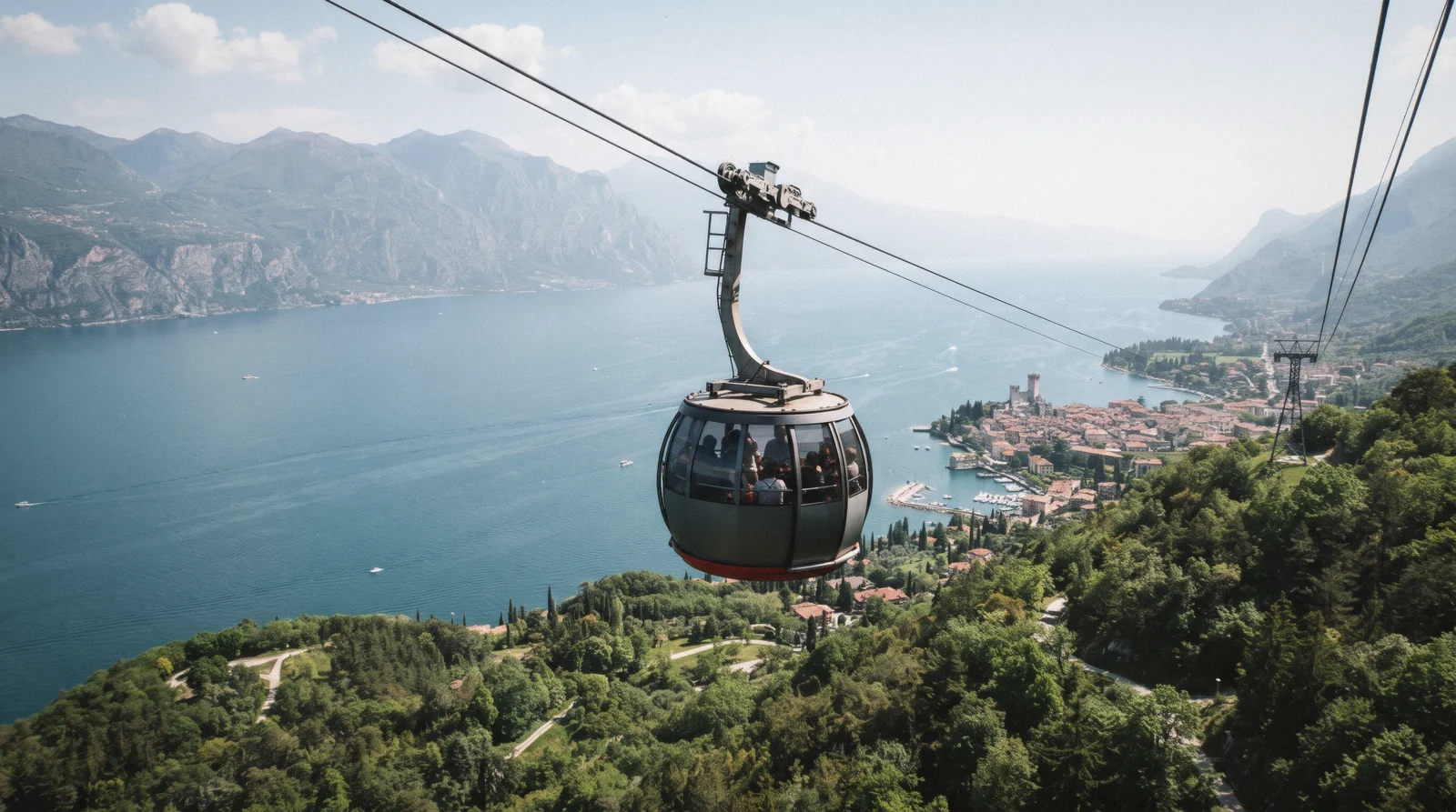 A rotating cabin of the Monte Baldo cable car climbing above Malcesine and Lake Garda, Italy