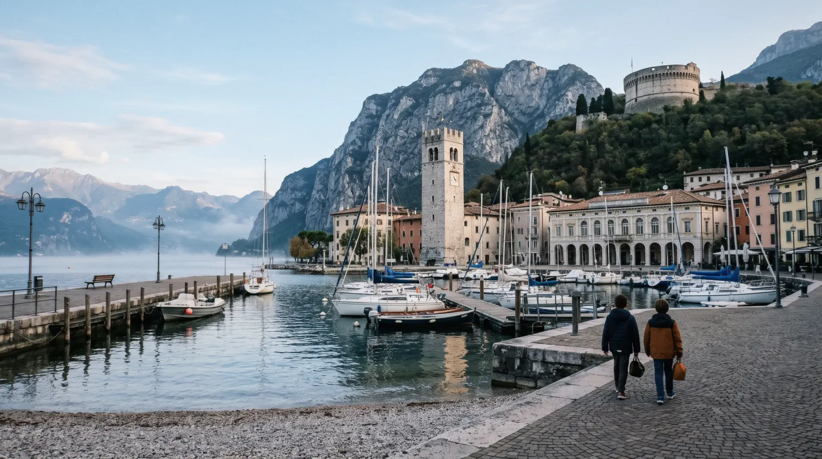 Riva del Garda harbour and the Torre Apponale under Monte Rocchetta at the north tip of Lake Garda, Italy
