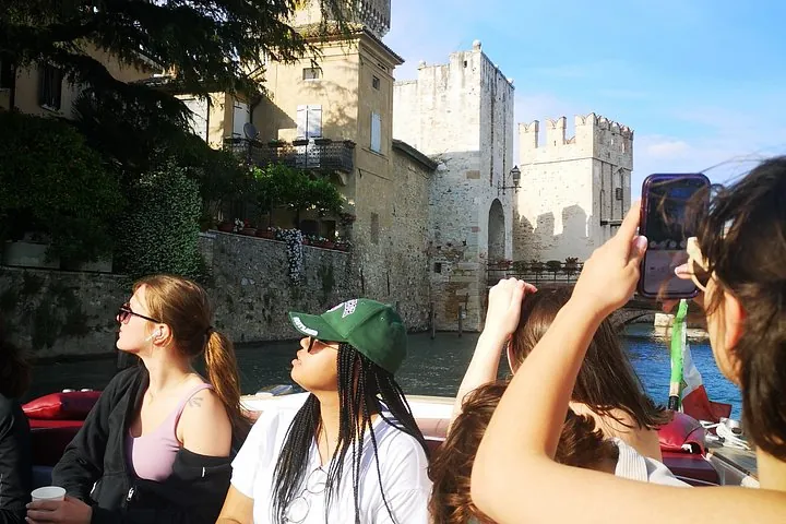 A small boat off the Sirmione peninsula, a Lake Garda cruise and guided walk away from the crowds