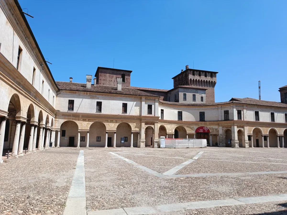 Piazza Castello and the towers of the Castle of St George in Mantua, a day trip from Lake Garda, Italy