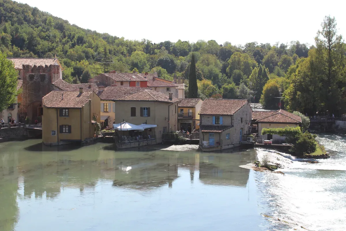Old mill houses on the Mincio river at Borghetto near Valeggio, an e-bike trip from Lake Garda, Italy