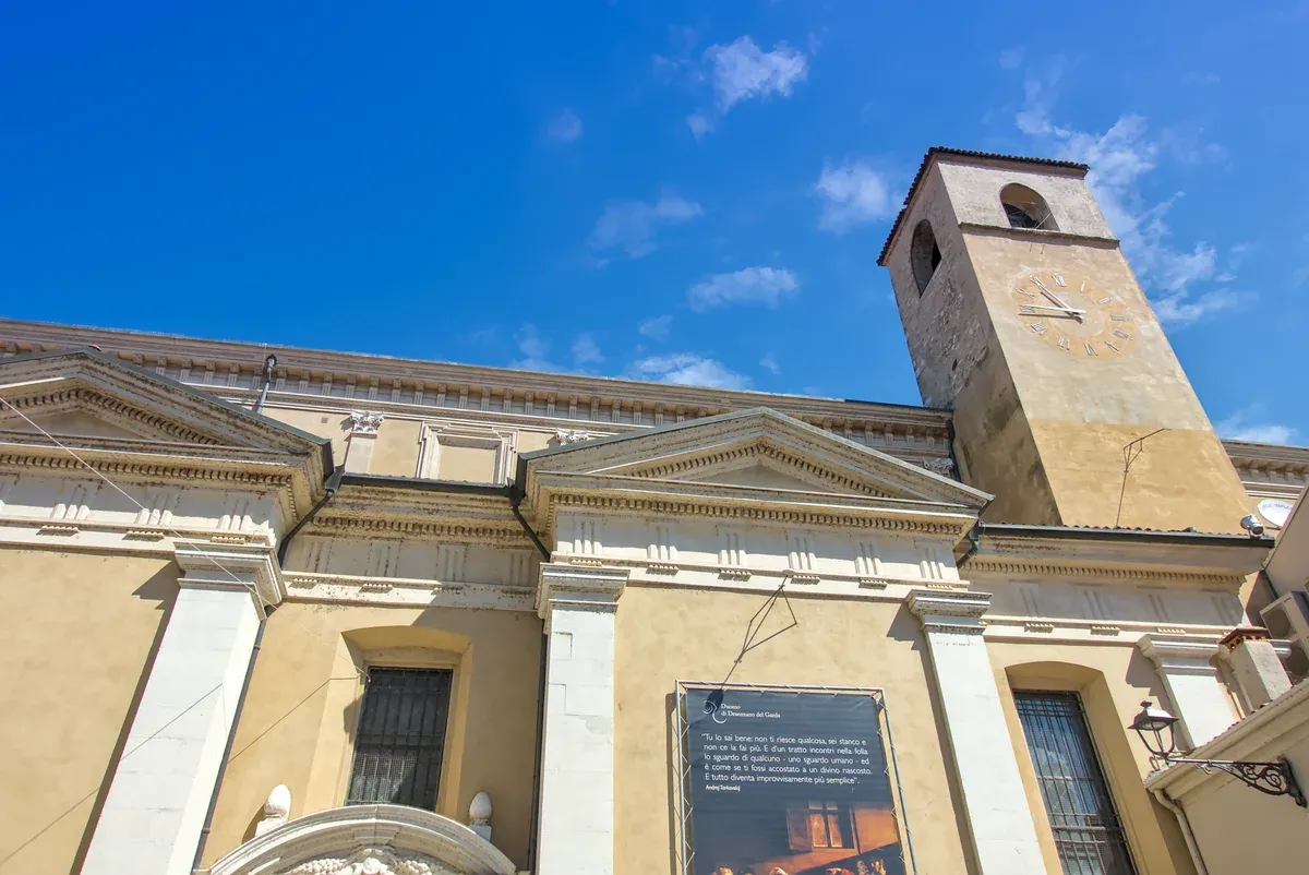 The facade and bell tower of the cathedral of Santa Maria Maddalena in Desenzano del Garda, Lake Garda, Italy