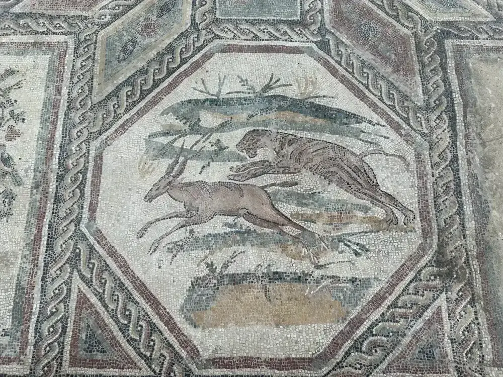 A Roman floor mosaic with a hunting scene in the Villa Romana of Desenzano del Garda, Lake Garda, Italy