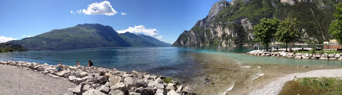 The Sabbioni shore at Riva del Garda with Monte Brione and the northern mountains, Lake Garda, Italy