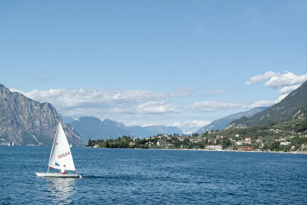 A sailing dinghy off Nago-Torbole at the north end of Lake Garda, Italy, where private motorboats are banned