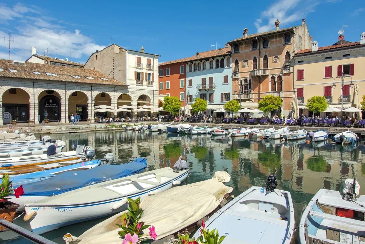 Boats in the Porto Vecchio of Desenzano del Garda, start of a Lake Garda in one day plan, Italy