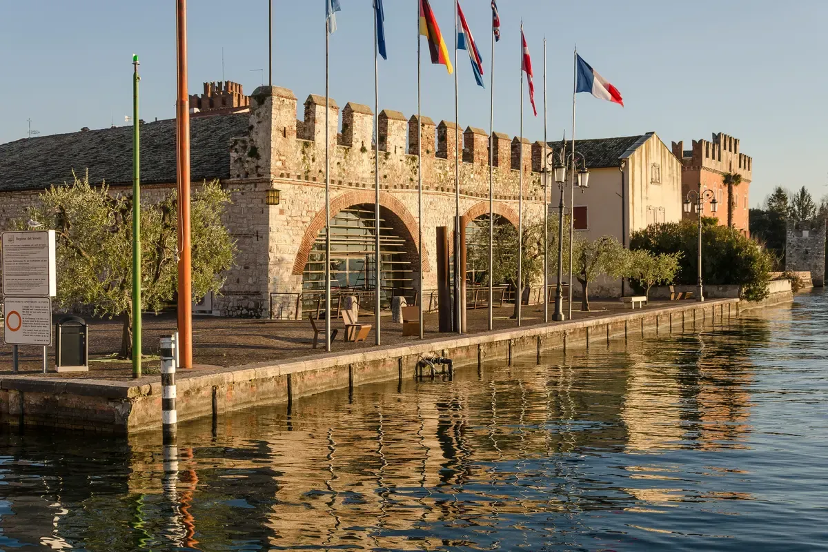 The battlemented Venetian customs house, the Dogana Veneta, on the old port of Lazise, Lake Garda, Italy