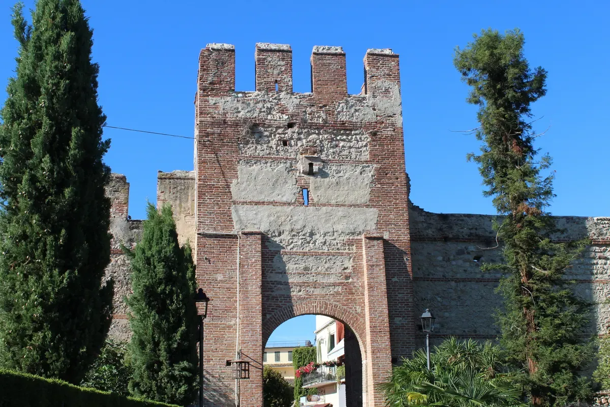 The brick Lion Gate in the medieval walls of Lazise on Lake Garda, Italy