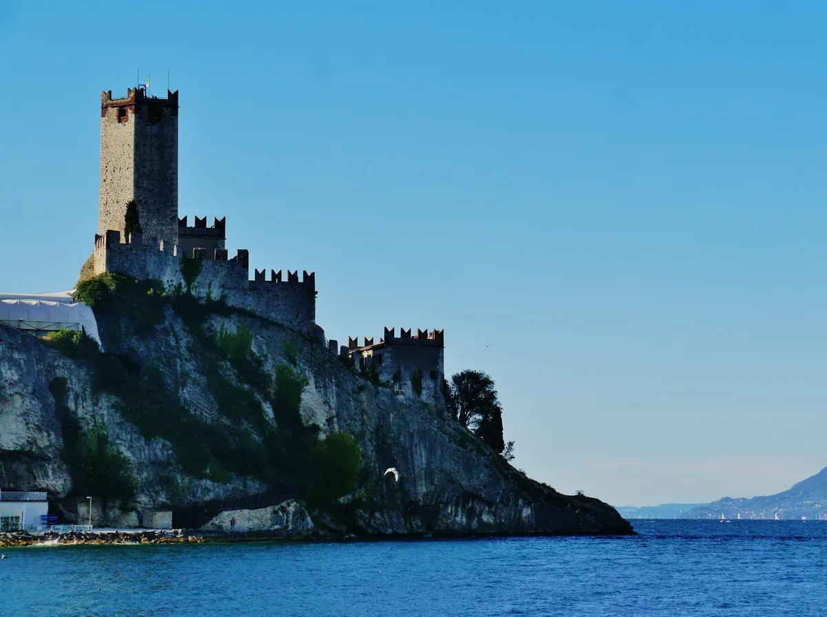 The Castello Scaligero di Malcesine and its battlements on the limestone rock above Lake Garda, Italy