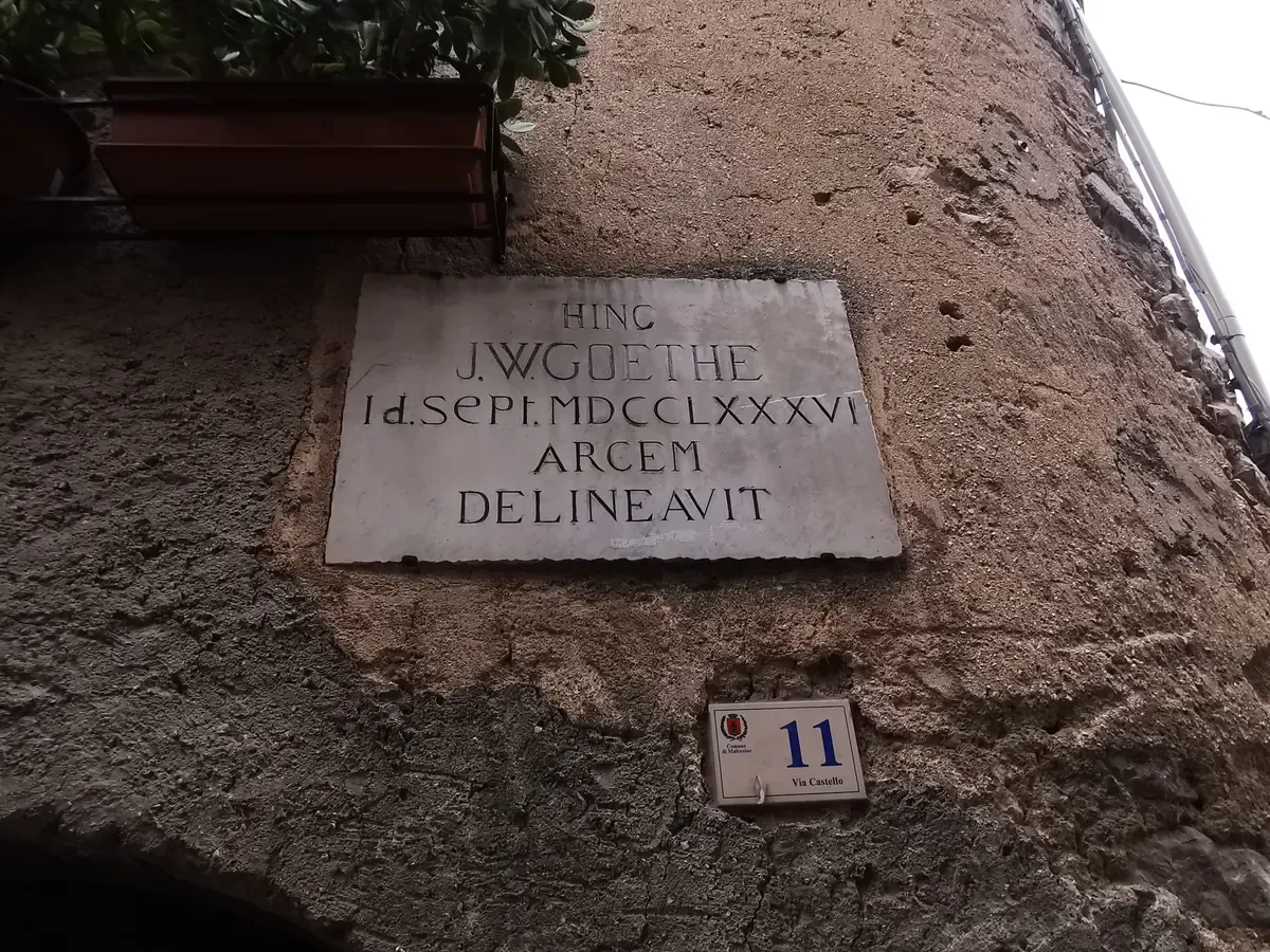 The Latin plaque on Via Castello in Malcesine, Lake Garda, Italy, recording Goethe's sketch of the castle in September 1786