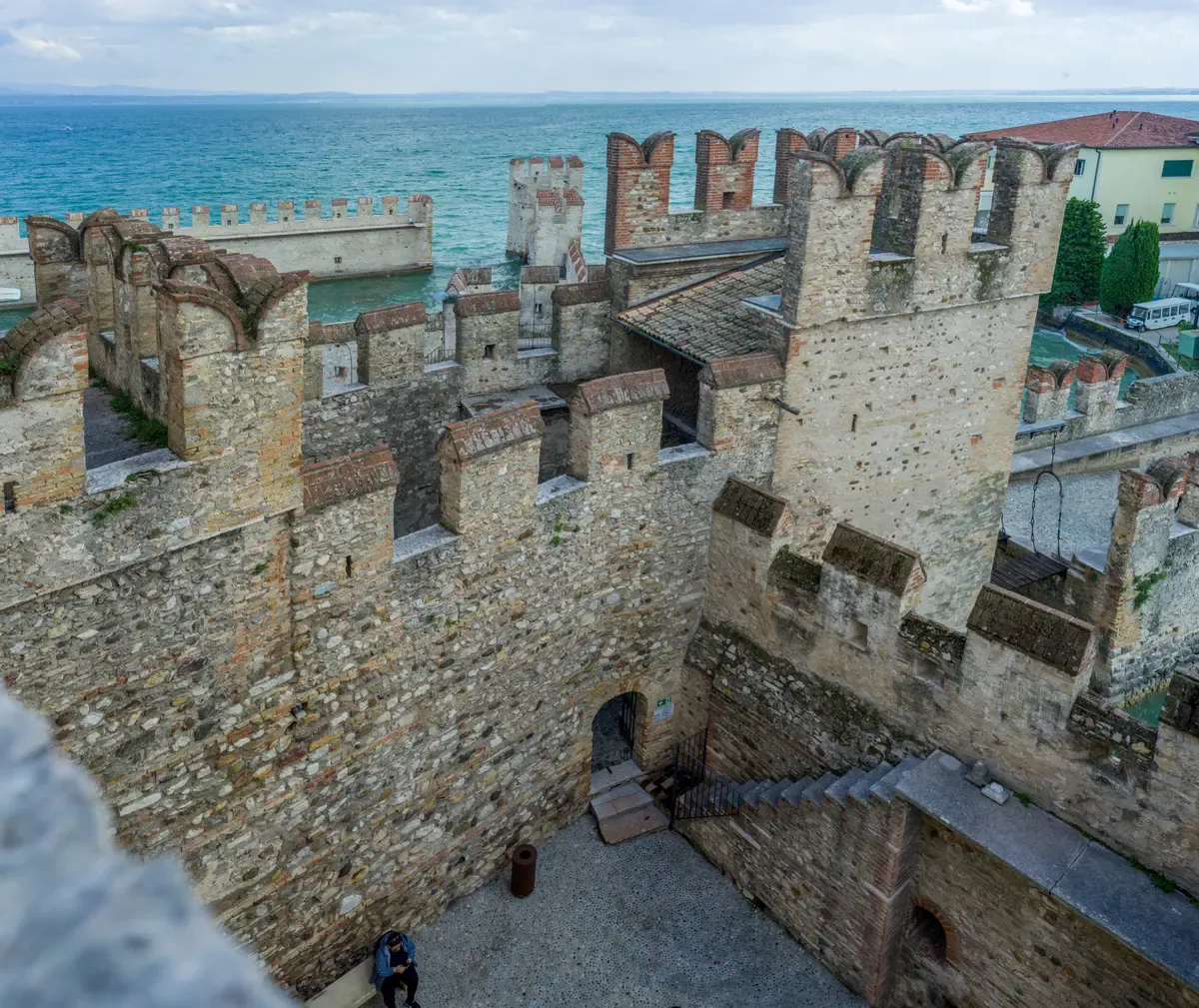 The swallowtail battlements and wall walks of the Scaligero Castle in Sirmione, Lake Garda, Italy