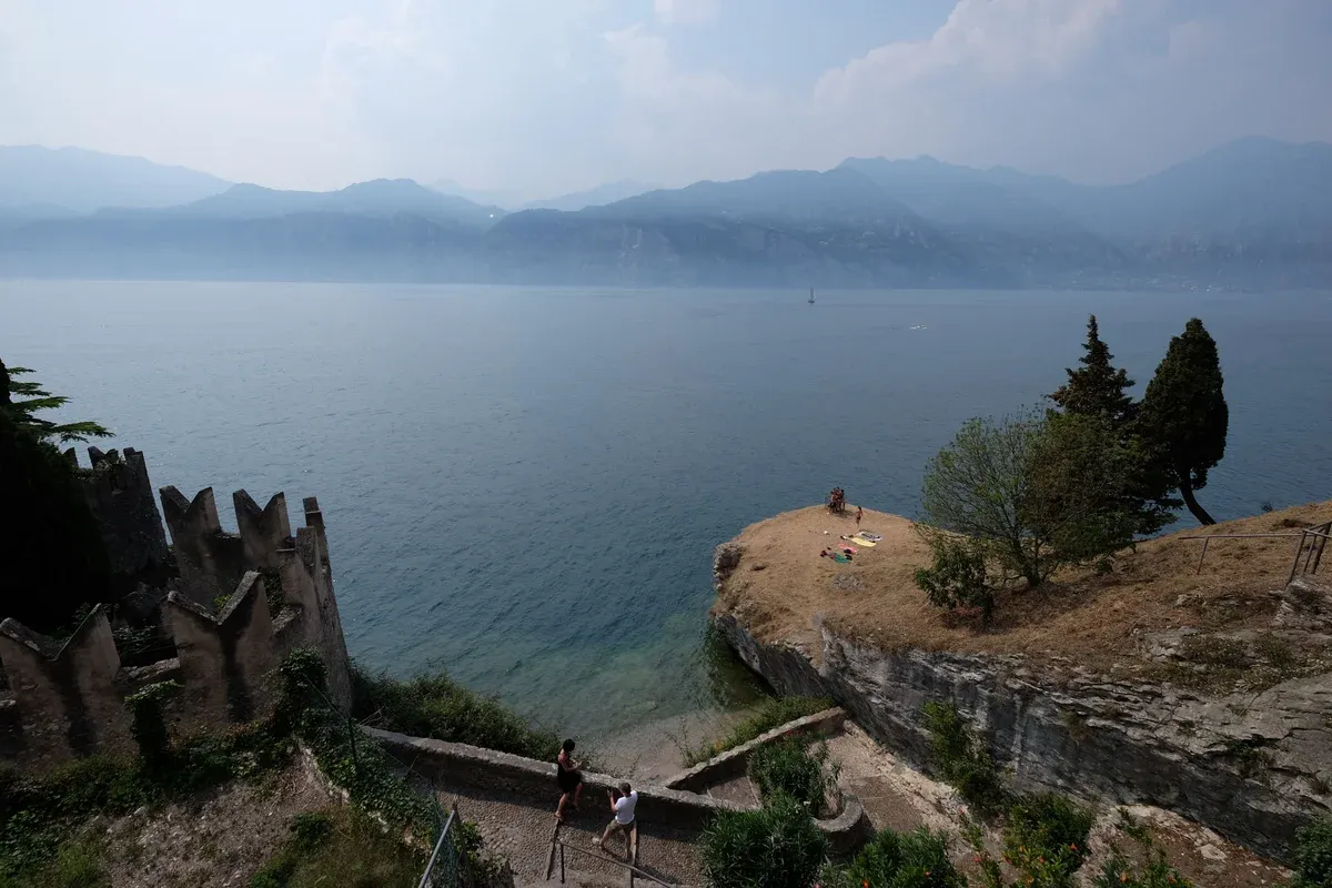 The lake seen over the battlements of Malcesine castle, one of the two towns compared in Sirmione or Malcesine, Lake Garda, Italy