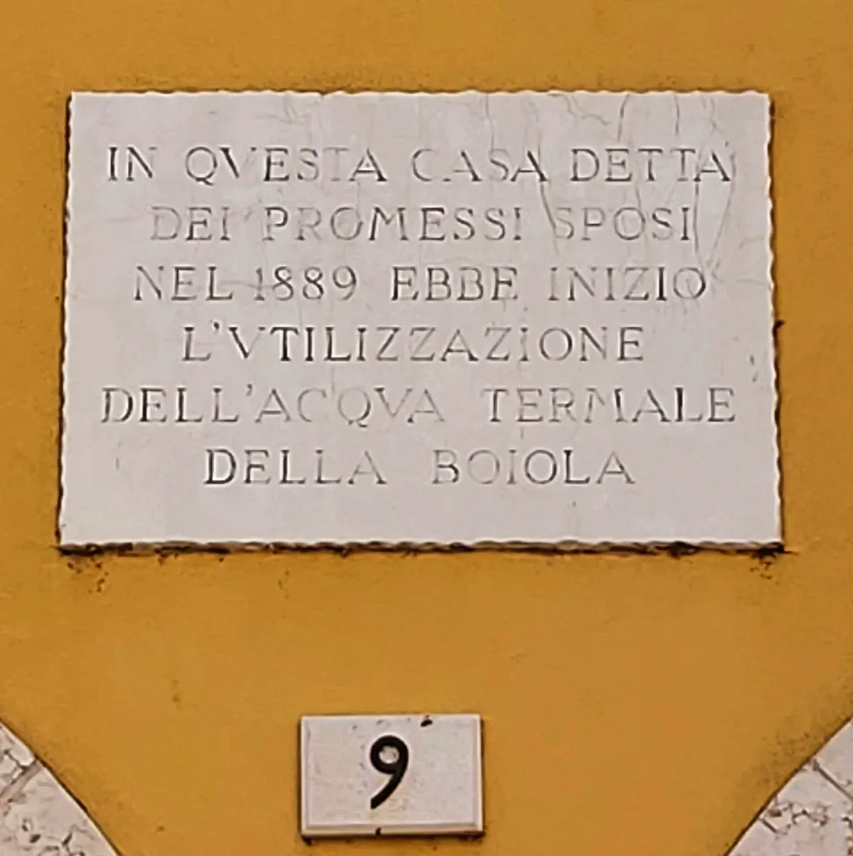 The 1889 plaque on the house dei Promessi Sposi marking the first use of the Boiola thermal water, Sirmione, Lake Garda, Italy