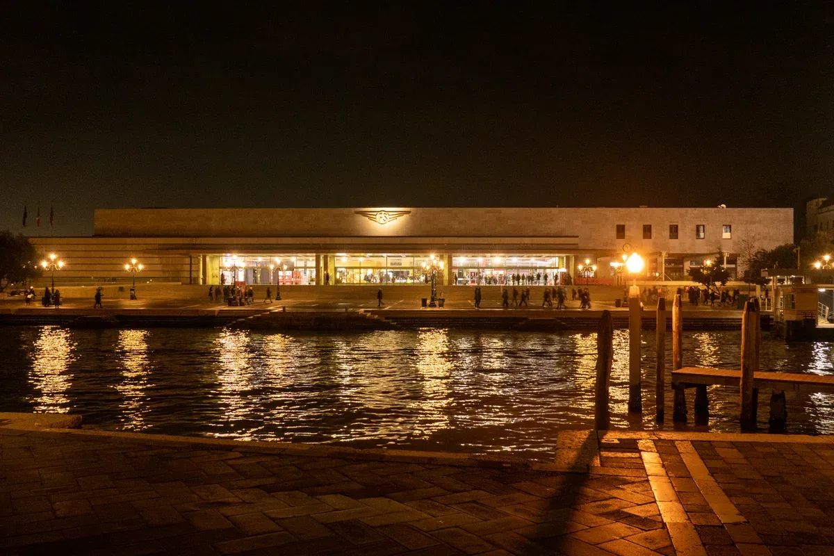 Venezia Santa Lucia station across the Grand Canal at night, where trains from Lake Garda arrive, Italy